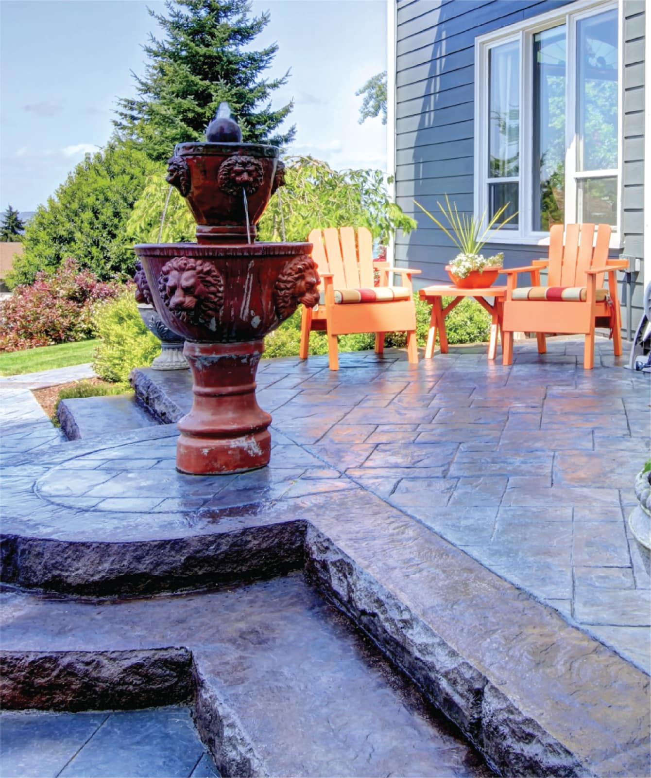Stamped-concrete patio with outdoor seating.