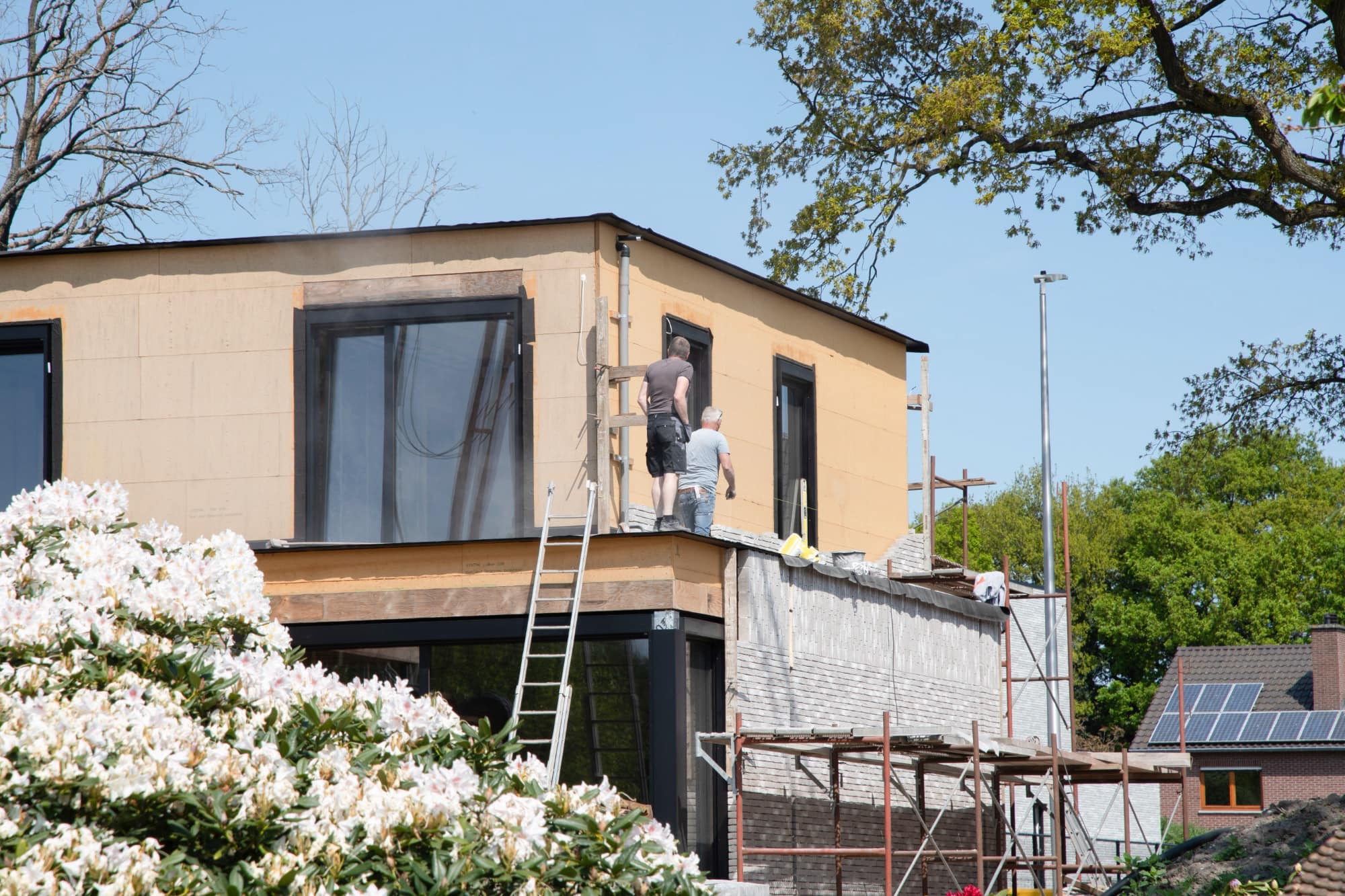 Construction crew working on a building exterior